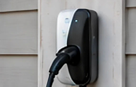 A wall-mounted Level 2 EV charger.