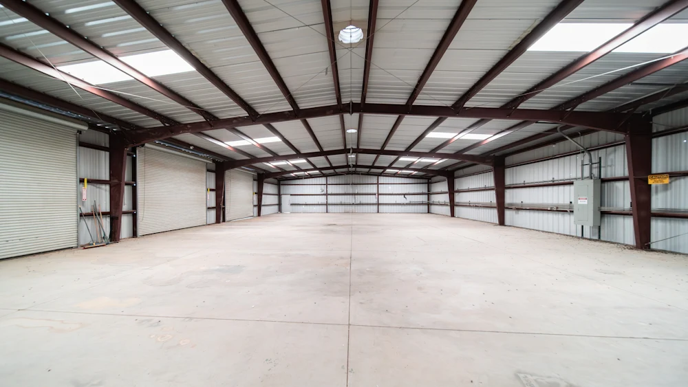 A warehouse with bright overhead LED lighting.