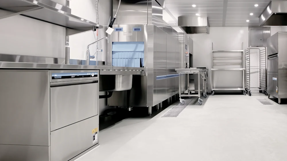 A commercial kitchen with stainless steel equipment.