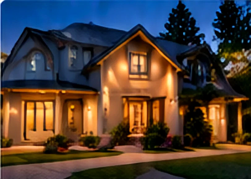 A two-story home with its lights on at dusk.